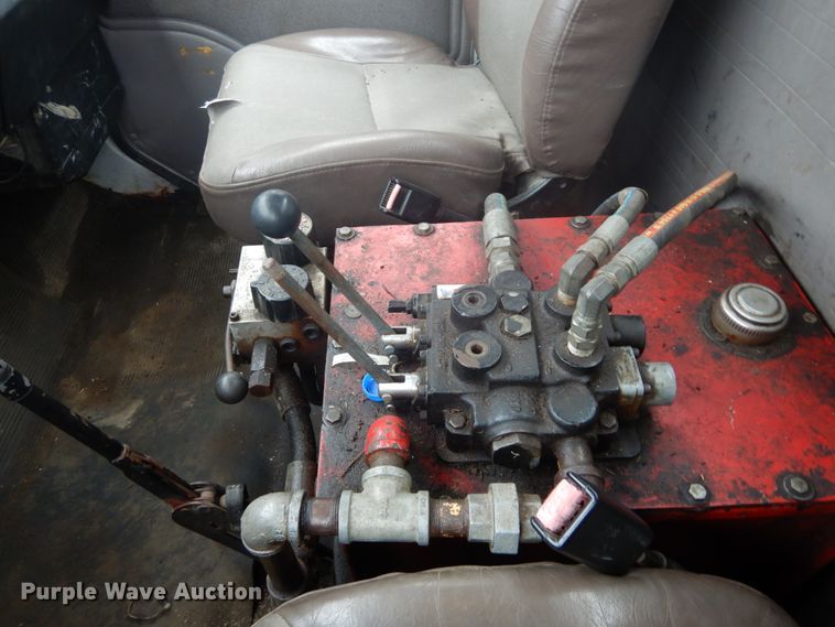 image for item GB9868 1999 International 4700 flat dump bed truck