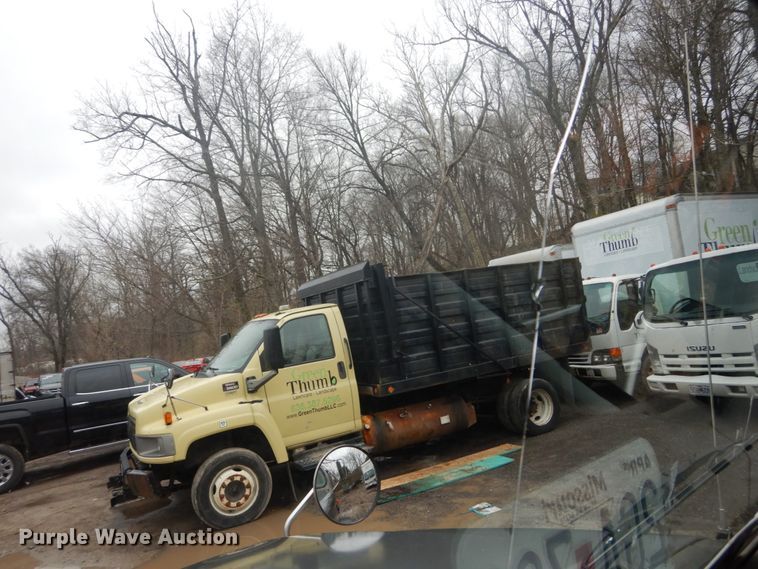 image for item GB9868 1999 International 4700 flat dump bed truck