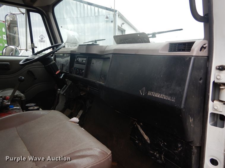 image for item GB9868 1999 International 4700 flat dump bed truck