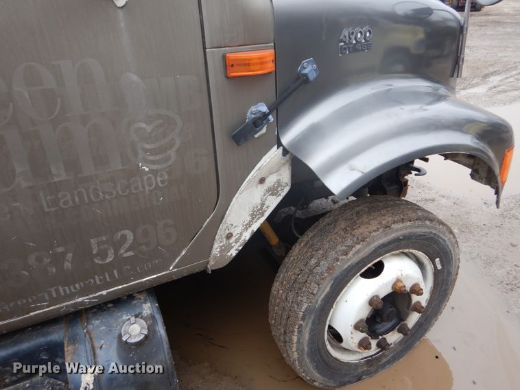 image for item GB9868 1999 International 4700 flat dump bed truck