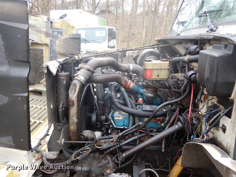 image for item GB9868 1999 International 4700 flat dump bed truck