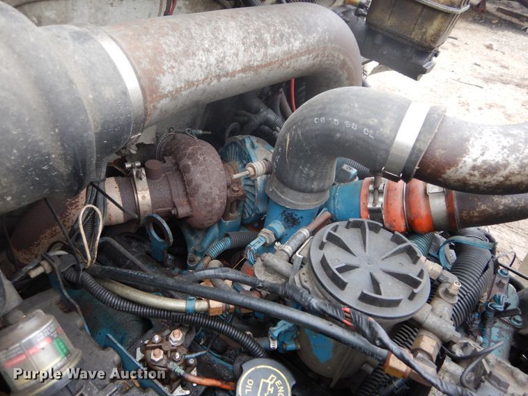 image for item GB9868 1999 International 4700 flat dump bed truck