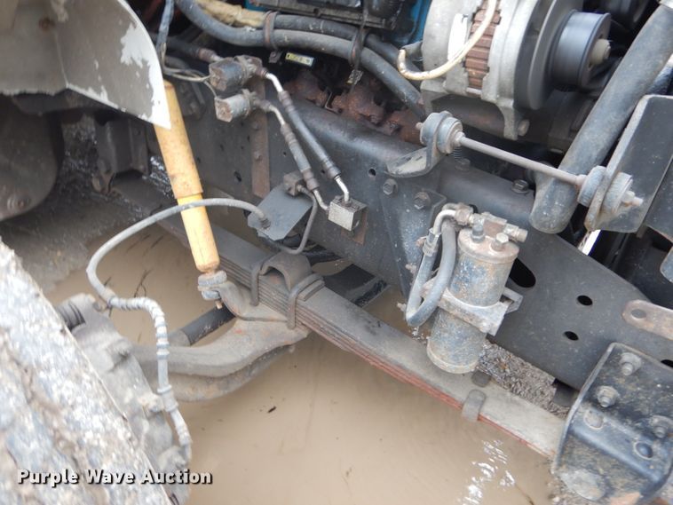 image for item GB9868 1999 International 4700 flat dump bed truck