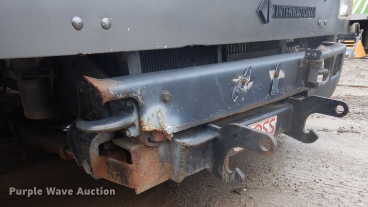 image for item GB9868 1999 International 4700 flat dump bed truck