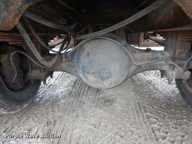 image for item GB9868 1999 International 4700 flat dump bed truck