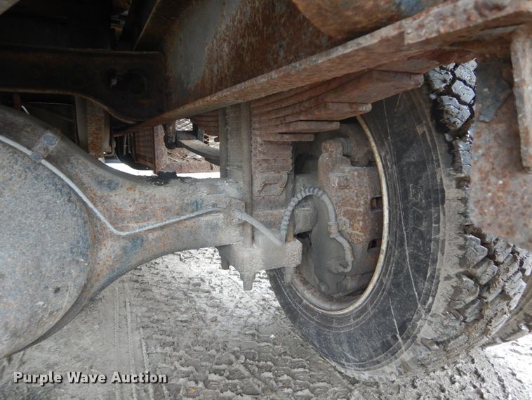 image for item GB9868 1999 International 4700 flat dump bed truck