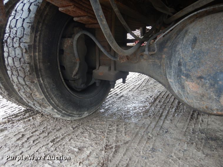 image for item GB9868 1999 International 4700 flat dump bed truck