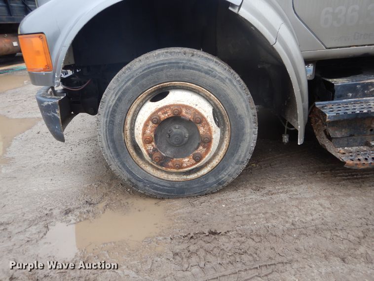 image for item GB9868 1999 International 4700 flat dump bed truck