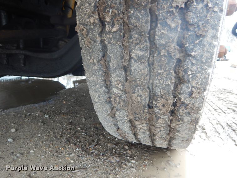 image for item GB9868 1999 International 4700 flat dump bed truck