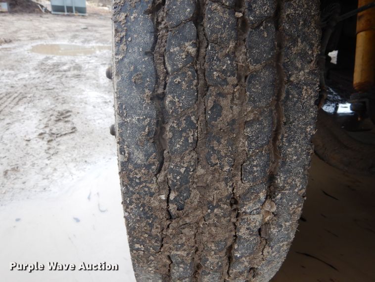 image for item GB9868 1999 International 4700 flat dump bed truck