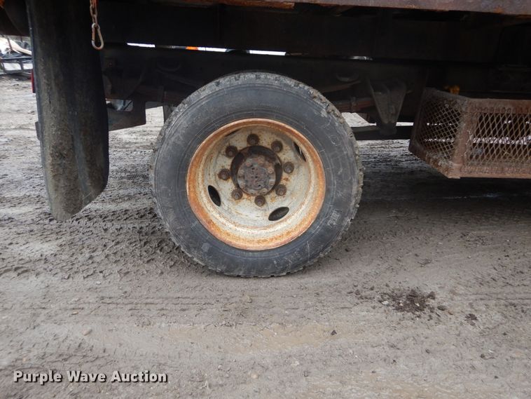 image for item GB9868 1999 International 4700 flat dump bed truck