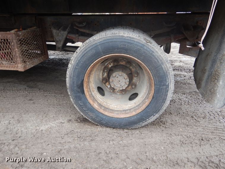 image for item GB9868 1999 International 4700 flat dump bed truck