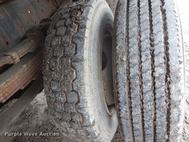 image for item GB9868 1999 International 4700 flat dump bed truck