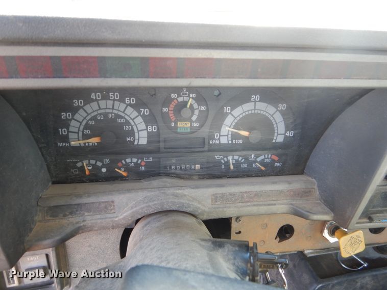 image for item FX9048 1999 GMC C7500 rollback truck