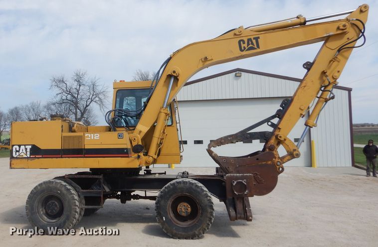 image for item GP9029 1986 Caterpillar 212 rubber tired excavator