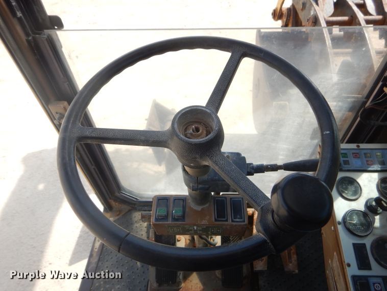 image for item GP9029 1986 Caterpillar 212 rubber tired excavator