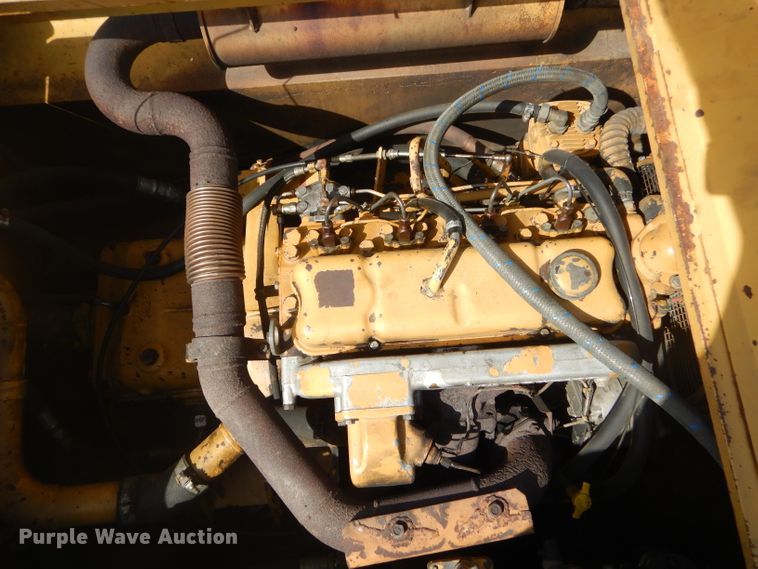 image for item GP9029 1986 Caterpillar 212 rubber tired excavator