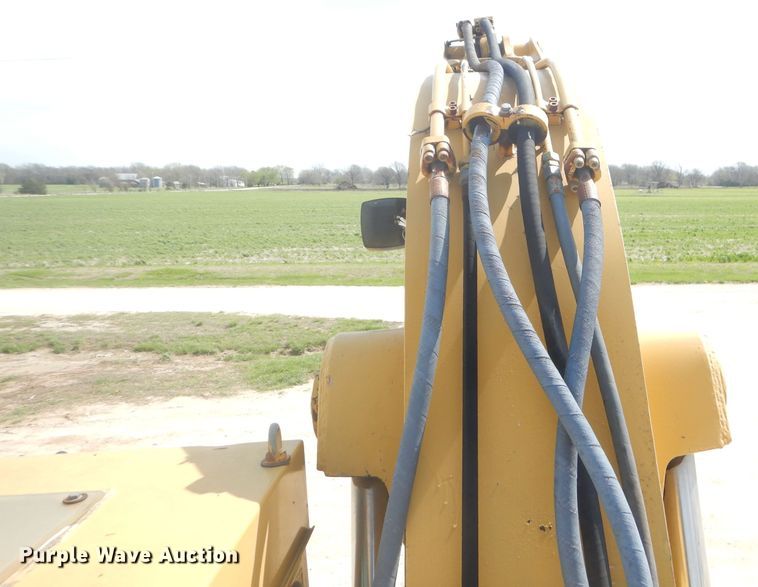 image for item GP9029 1986 Caterpillar 212 rubber tired excavator