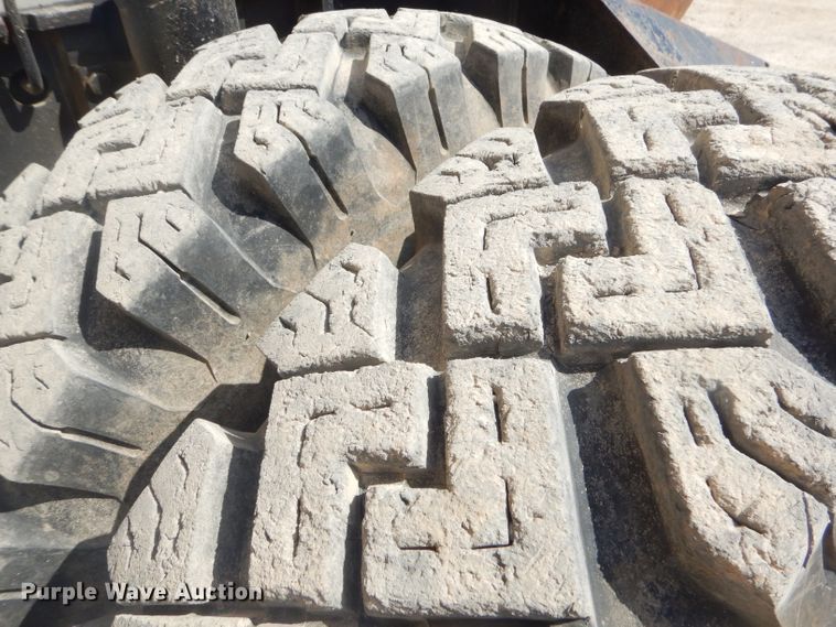 image for item GP9029 1986 Caterpillar 212 rubber tired excavator