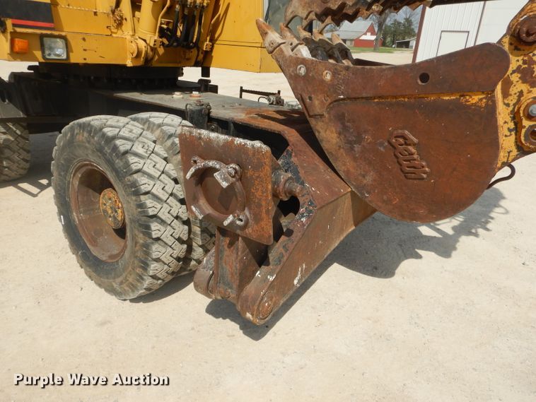 image for item GP9029 1986 Caterpillar 212 rubber tired excavator