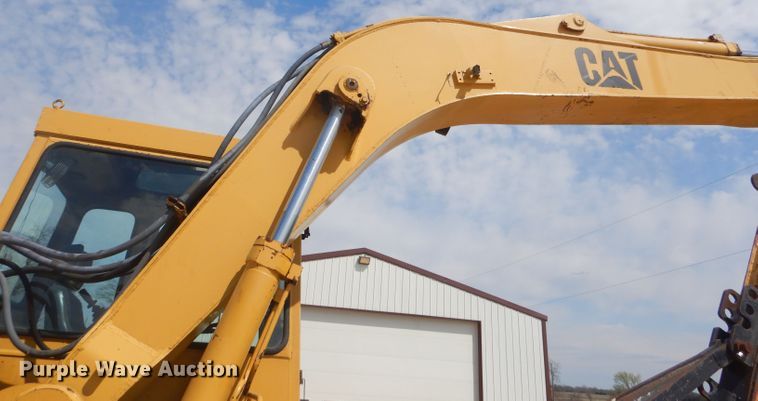 image for item GP9029 1986 Caterpillar 212 rubber tired excavator