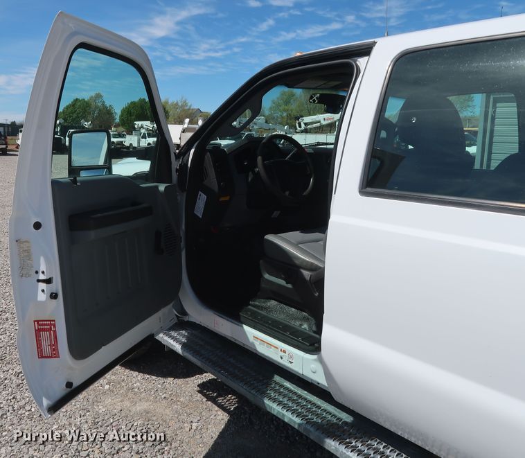 image for item GS9846 2013 Ford F550 Super Duty XL Crew Cab utility bed truck with crane