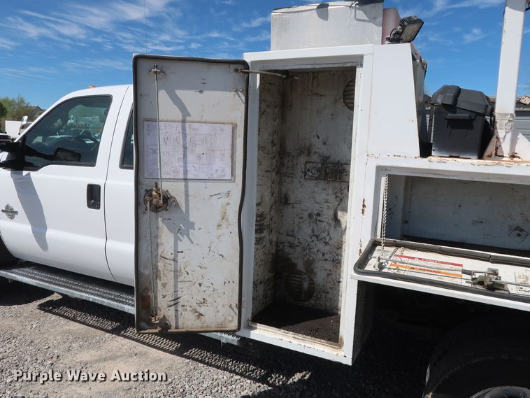 image for item GS9846 2013 Ford F550 Super Duty XL Crew Cab utility bed truck with crane