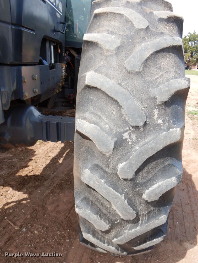 image for item GK9164 New Holland TV140 bi-directional tractor