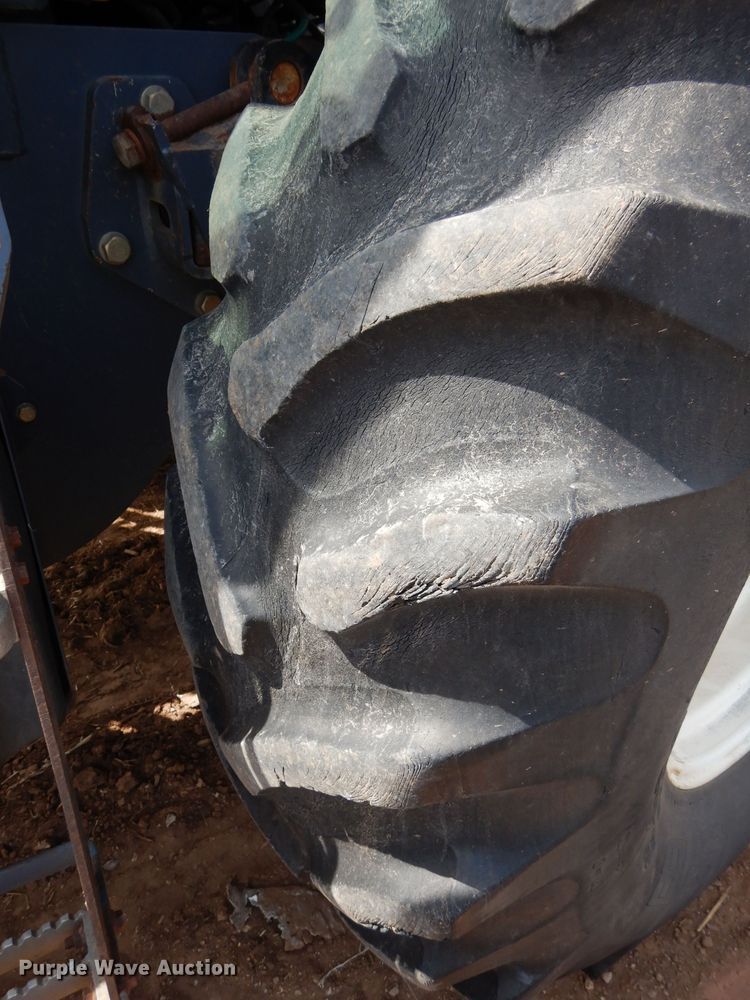 image for item GK9164 New Holland TV140 bi-directional tractor