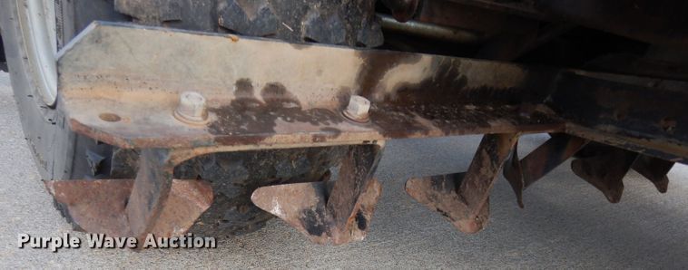 image for item HT9109 2000 Cushman Groom Master bunker rake