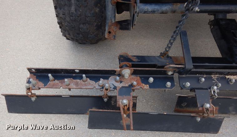 image for item HT9109 2000 Cushman Groom Master bunker rake