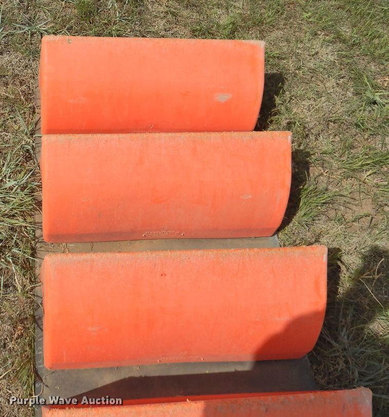 image for item DI0094 Approximately 312 Tiger-Tuff conveyor buckets with conveyor belt
