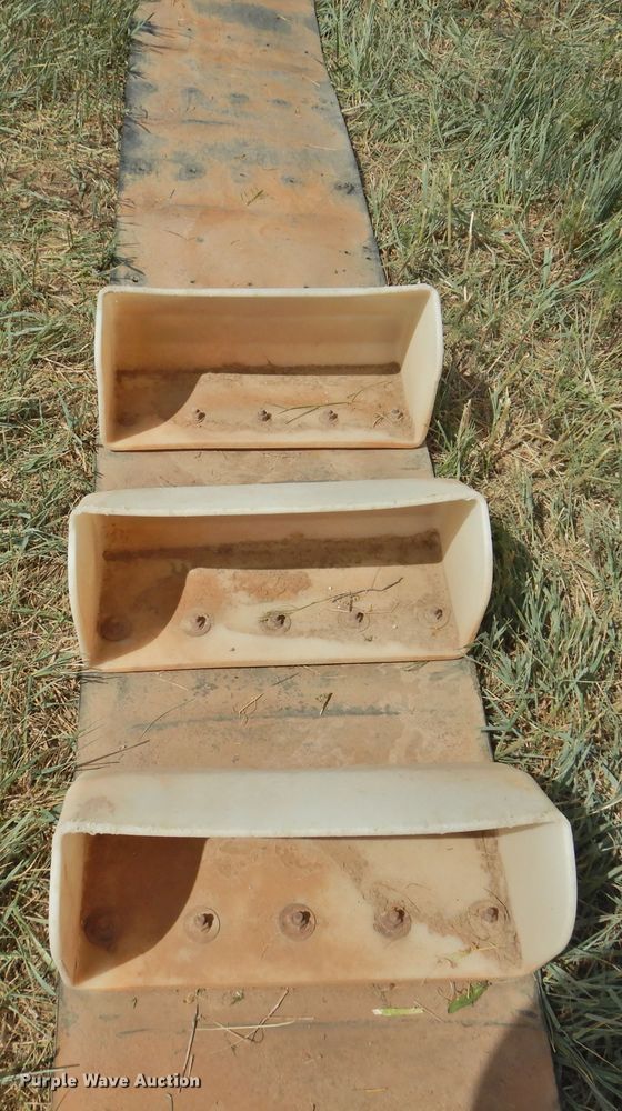 image for item DI0095 Approximately 234 Tapco conveyor buckets with conveyor belt