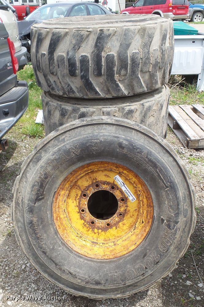 image for item EM9990 (4) Titan 14-17.5NHS tires and wheels