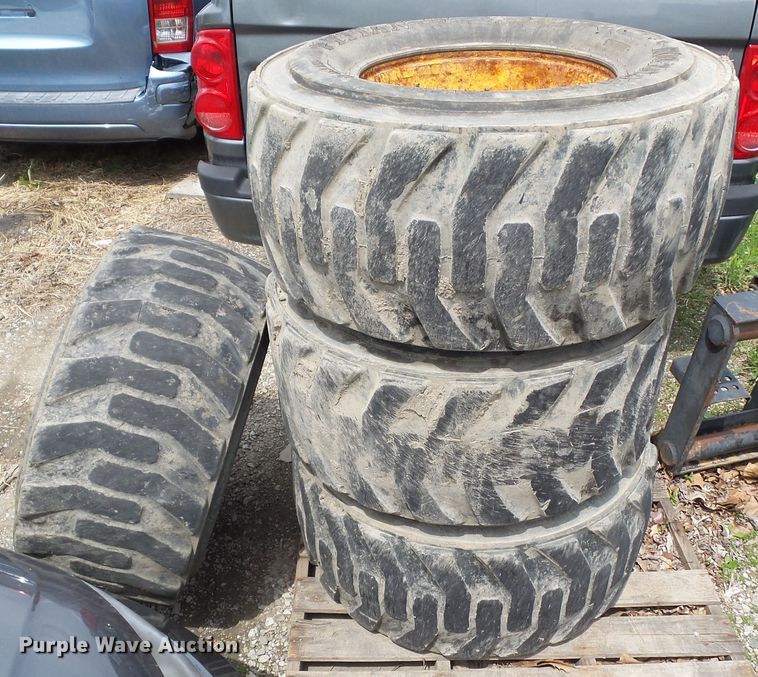 image for item EM9990 (4) Titan 14-17.5NHS tires and wheels