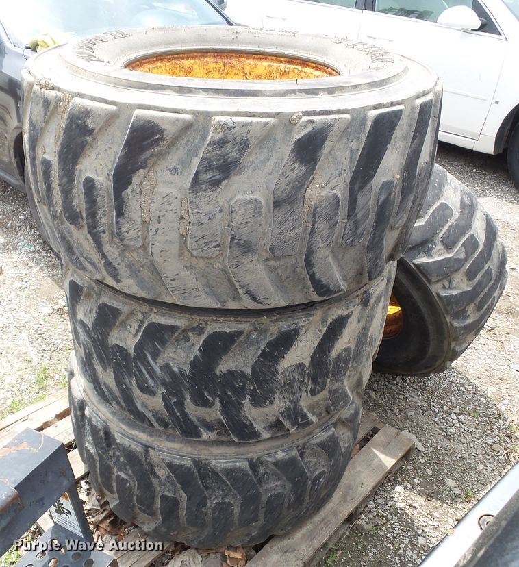 image for item EM9990 (4) Titan 14-17.5NHS tires and wheels