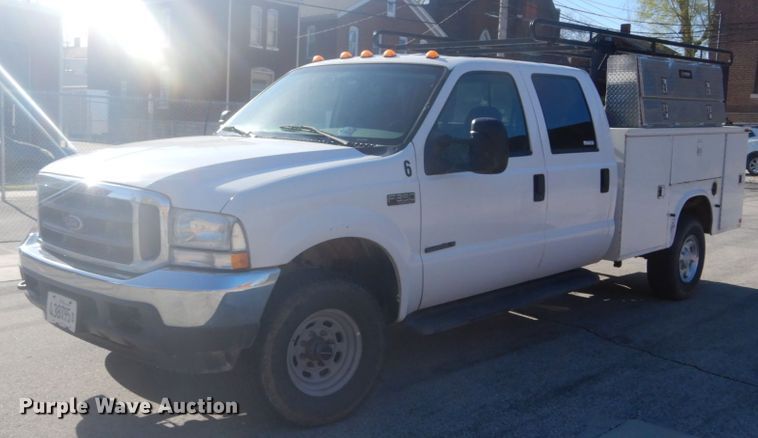 image for item GB9956 2002 Ford F350 Super Duty  Crew Cab utility bed pickup truck