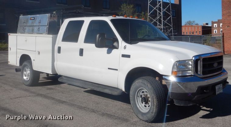 image for item GB9956 2002 Ford F350 Super Duty  Crew Cab utility bed pickup truck