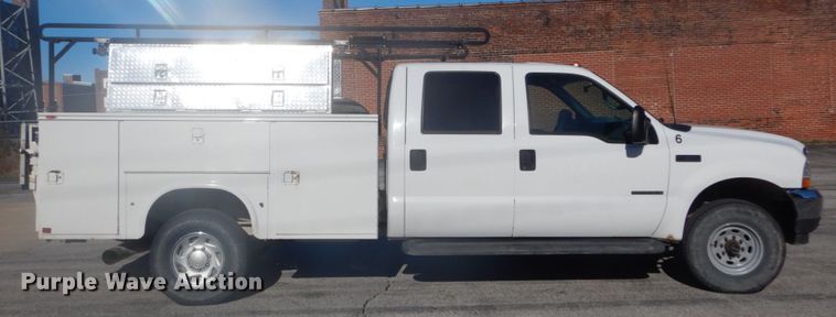 image for item GB9956 2002 Ford F350 Super Duty  Crew Cab utility bed pickup truck