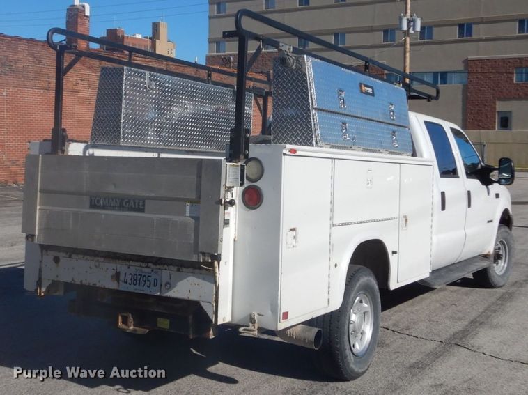 image for item GB9956 2002 Ford F350 Super Duty  Crew Cab utility bed pickup truck