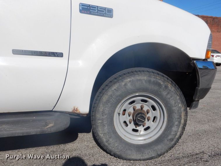 image for item GB9956 2002 Ford F350 Super Duty  Crew Cab utility bed pickup truck