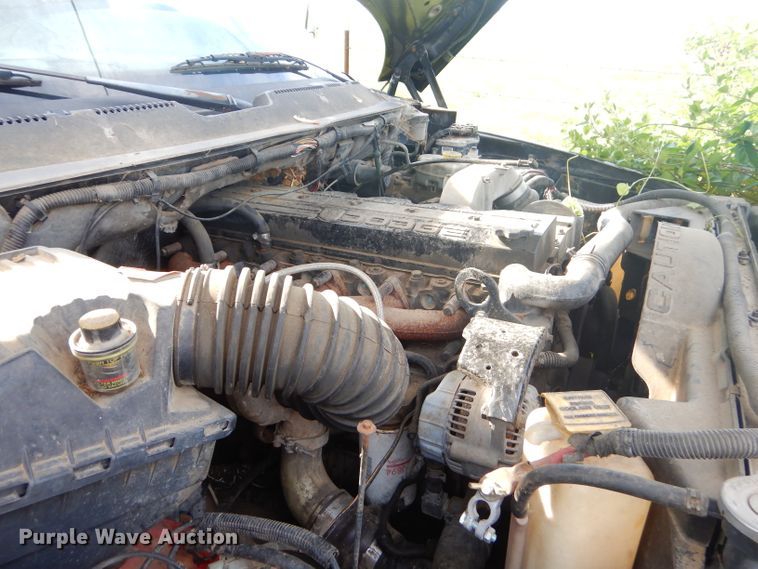 image for item GN9254 1999 Dodge Ram 3500 Laramie  flatbed pickup truck