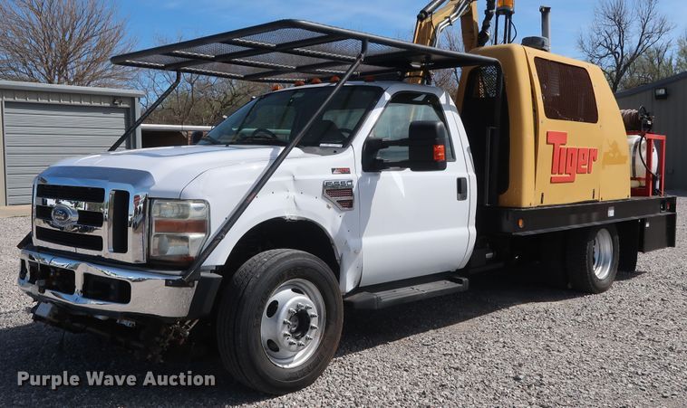 image for item GS9840 2008 Ford F550 Super Duty XLT flatbed truck with boom mower