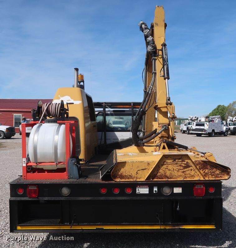 image for item GS9840 2008 Ford F550 Super Duty XLT flatbed truck with boom mower