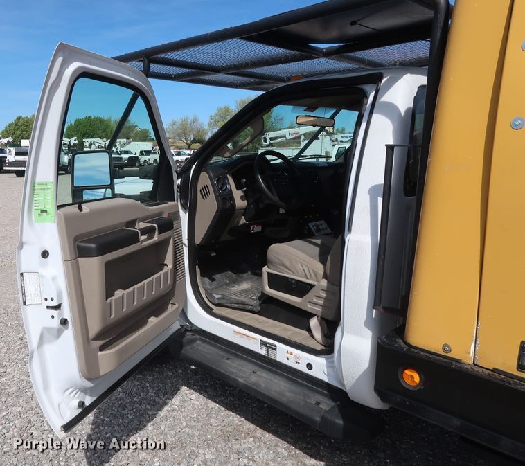 image for item GS9840 2008 Ford F550 Super Duty XLT flatbed truck with boom mower