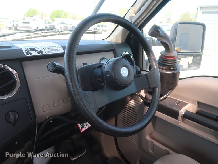 image for item GS9840 2008 Ford F550 Super Duty XLT flatbed truck with boom mower