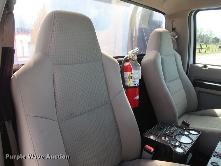 image for item GS9840 2008 Ford F550 Super Duty XLT flatbed truck with boom mower