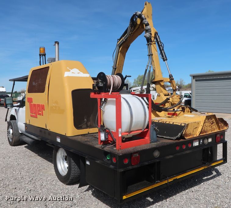 image for item GS9840 2008 Ford F550 Super Duty XLT flatbed truck with boom mower