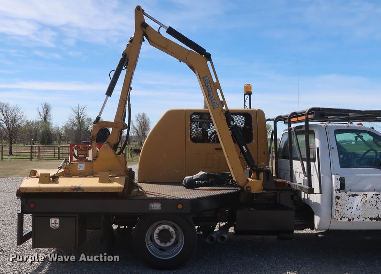 image for item GS9840 2008 Ford F550 Super Duty XLT flatbed truck with boom mower