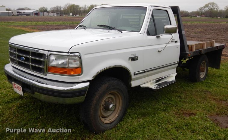 image for item GY9054 1997 Ford F250  flatbed pickup truck